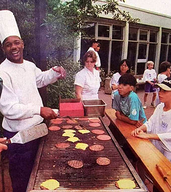 AOC director Lucius Floyd cooking for Participants